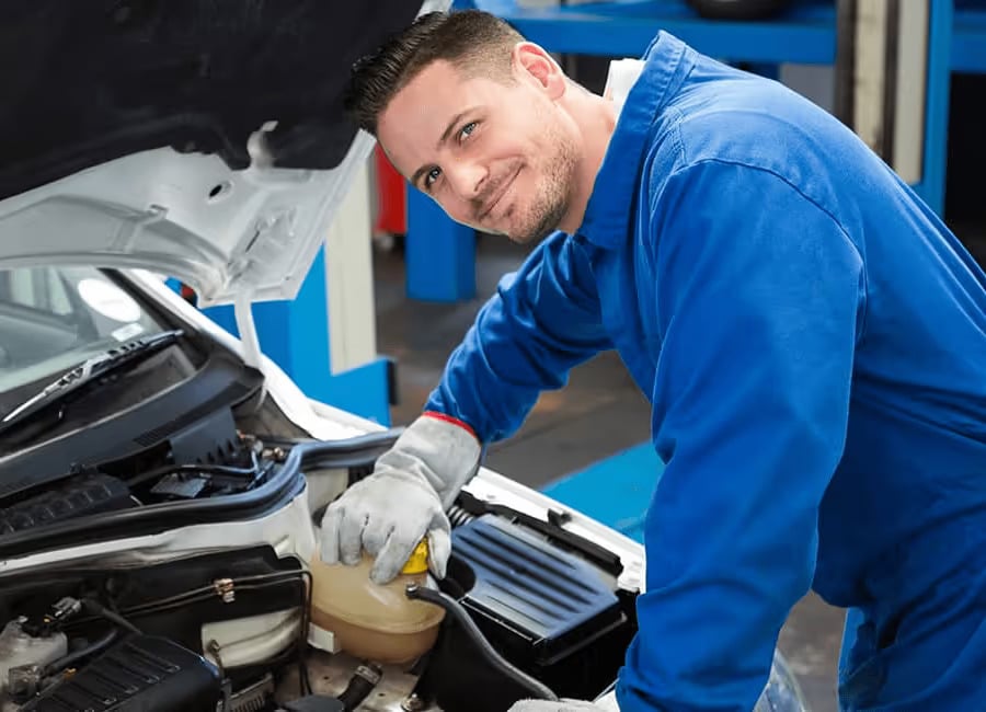 technician-checks-under-carhood