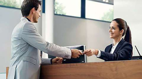 Man handing a woman his car keys