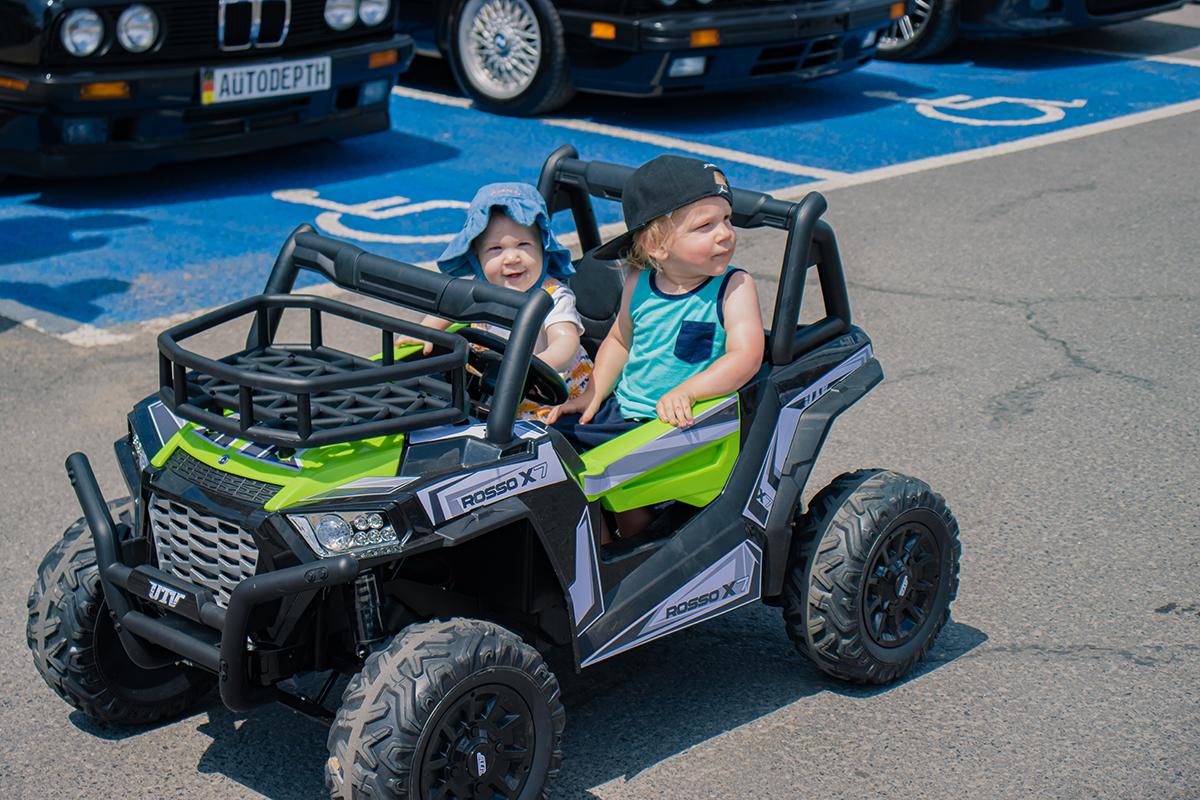 Cars and Coffee Event Toddlers Driving a Toy Car